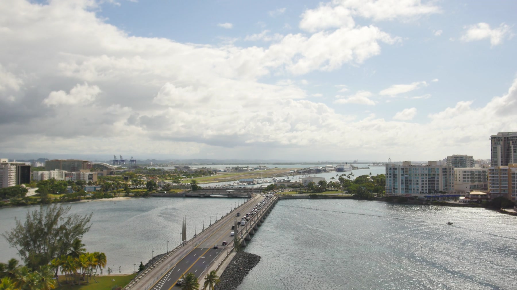 Aerial view of San Juan waterfront, roads, and surrounding development